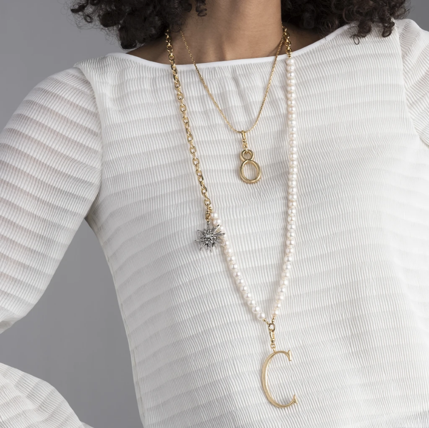 The Lulu Frost radiant charm features an Art Deco-inspired star motif that represents transcendence. Pair with one of the chain bases and add additional charms to create a special piece all your own.