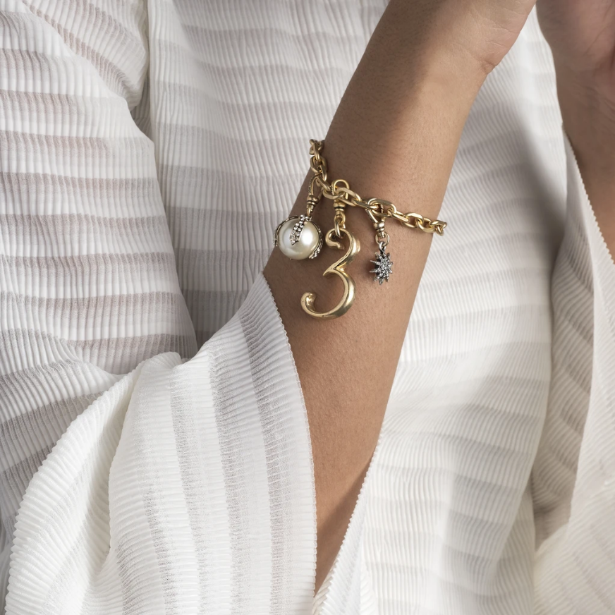 The Lulu Frost Electra Star is named for a cluster of stars far out in the Universe. The petite star charm features an array of sparkling crystal. Pair with one of the chain bases and mix with other charms to create your own look.