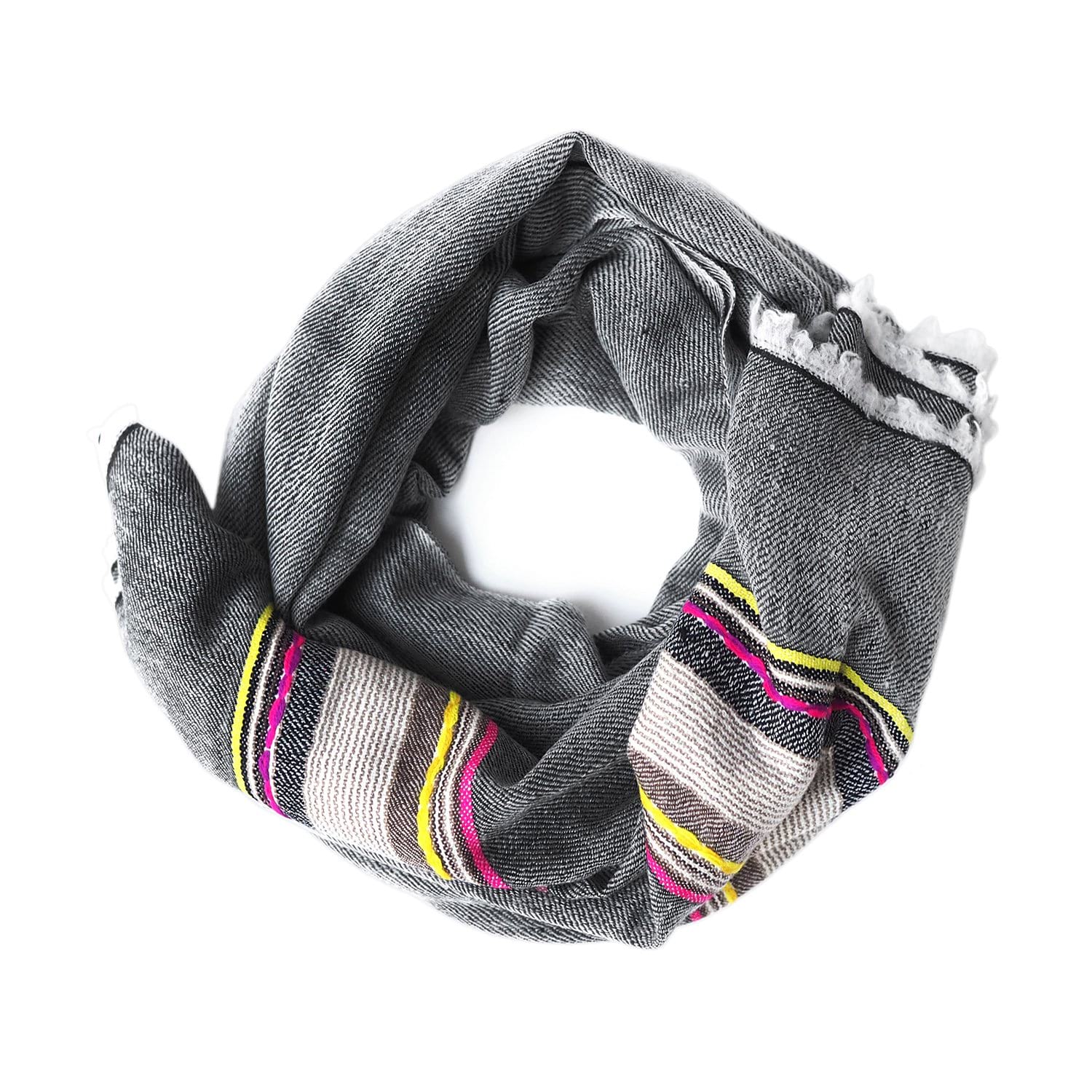 Black with a touch of colour, this pashmina comes from the Himalayan region of India. Made out of the finest Ibex wool, it will keep you warm and add some colour to your dreary winter outfit.