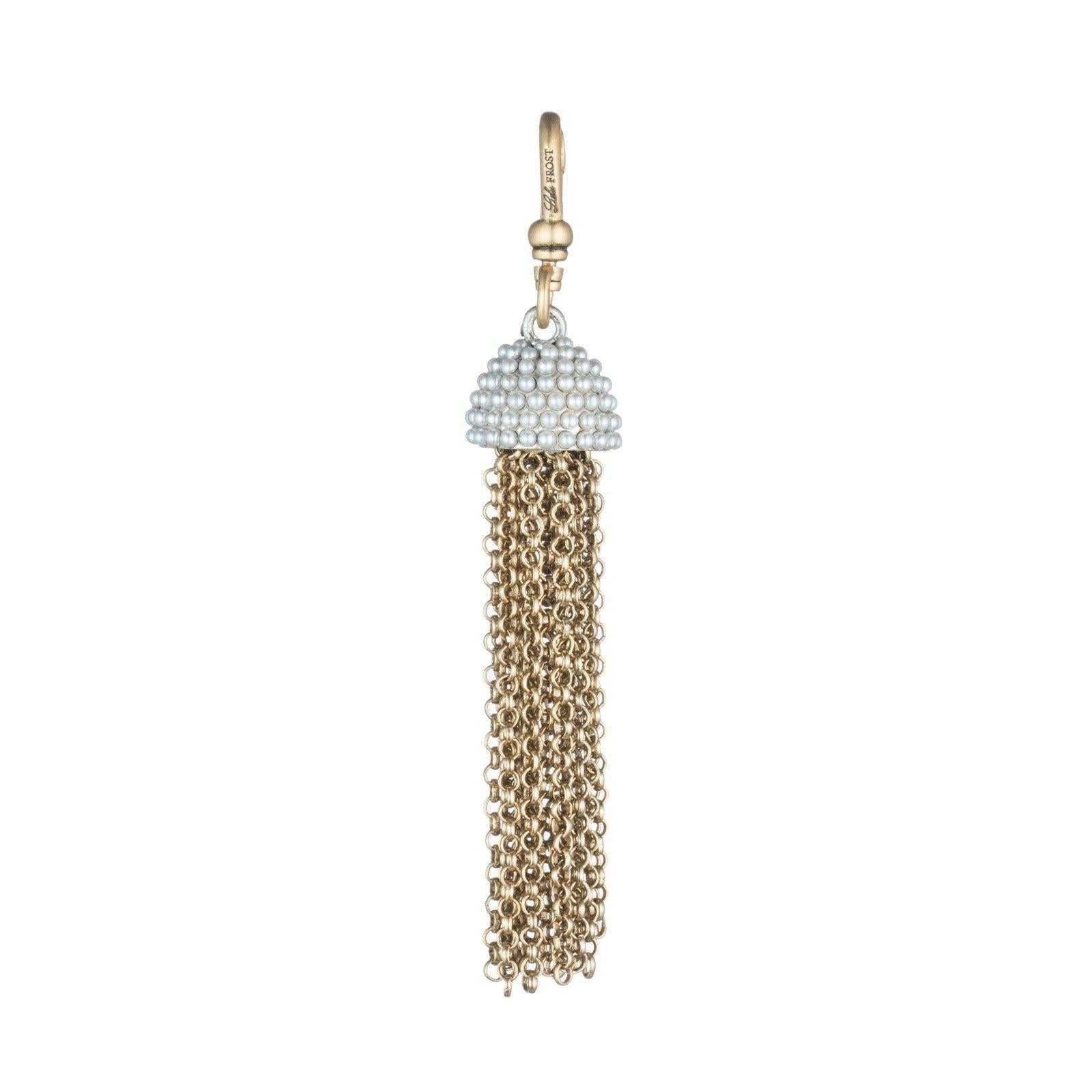 This Lulu Frost charm is inspired by 60's icon Ursula Andress, featuring pearl-encrusted dome tops paired with cascading chain tassels. Pair with one of the chain bases and add additional charms to create a special piece all your own. 