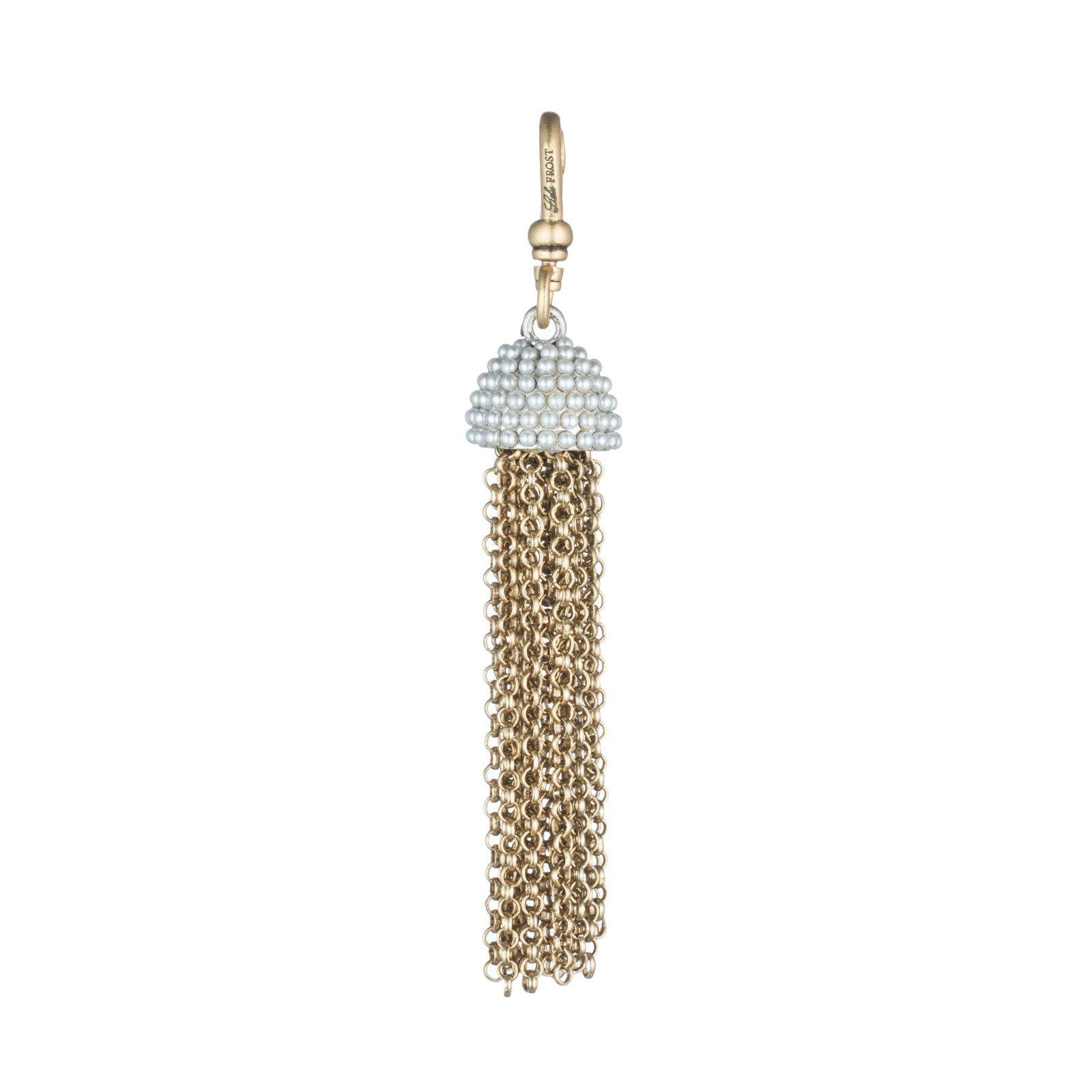 This Lulu Frost charm is inspired by 60's icon Ursula Andress, featuring pearl-encrusted dome tops paired with cascading chain tassels. Pair with one of the chain bases and add additional charms to create a special piece all your own.