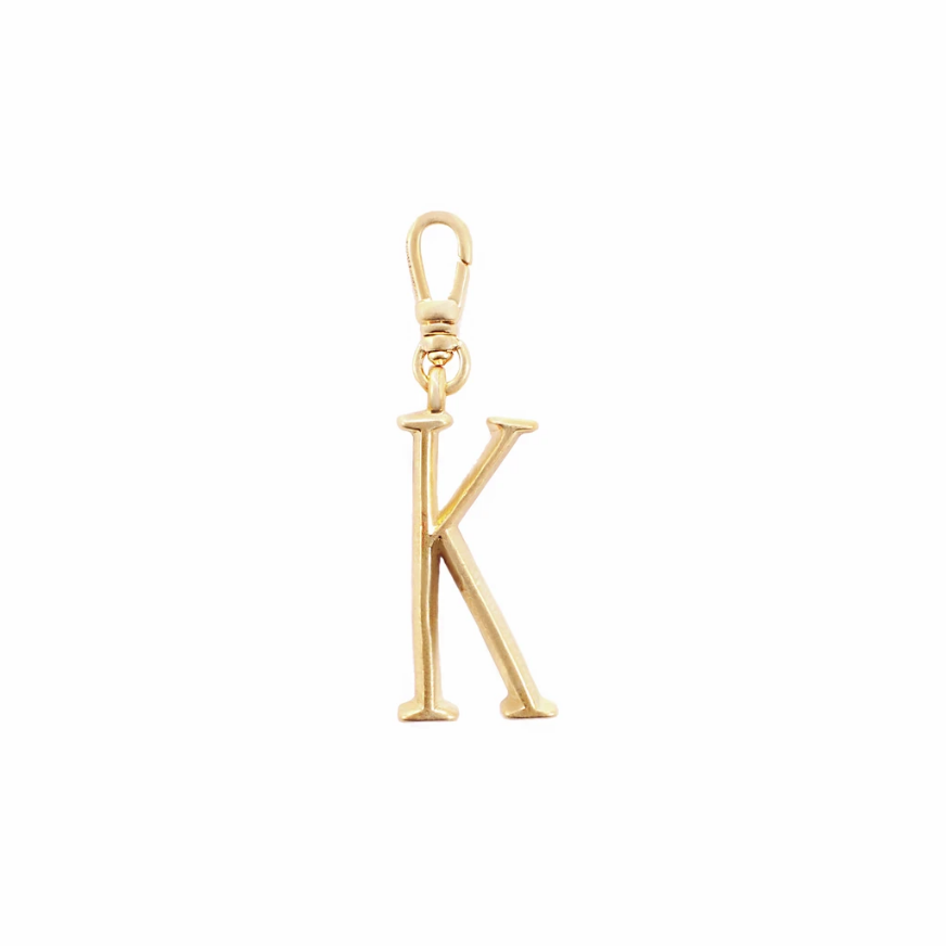 Lulu Frost Plaza Letter K in a smaller version of the original font from New York's iconic Plaza Hotel. Pair with one of the Plaza chain bases and add additional charms to create a special piece all your own. 