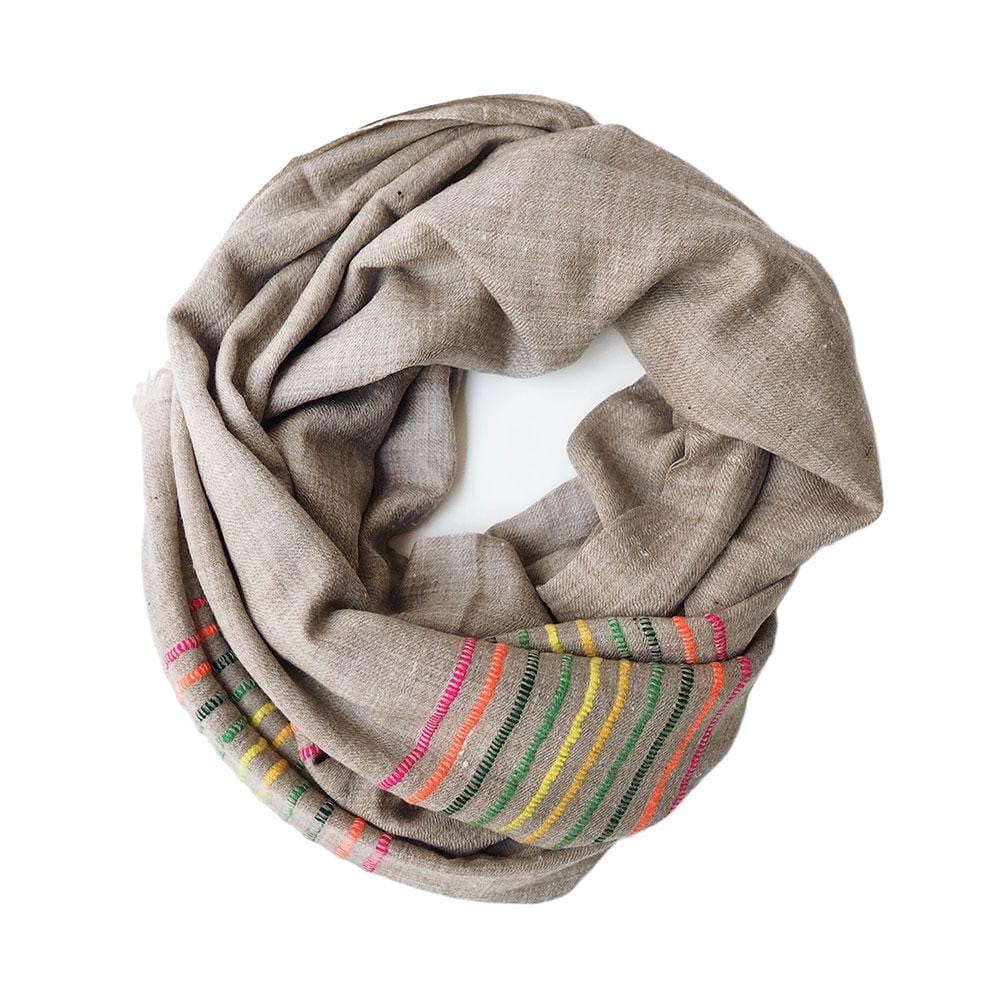 A natural coloured pashmina is given an added touch of colour with some modern stitching.  This scarf comes from the Himalayan region of India.  Made out of the finest Ibex wool, it will keep you warm and add some colour to your dreary winter outfit.