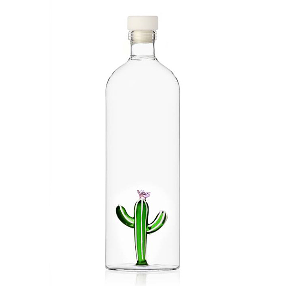 Green cactus with pink flower on top glass bottle